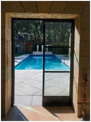 After: added back door with a view of the pool After: added back door with a view of the pool